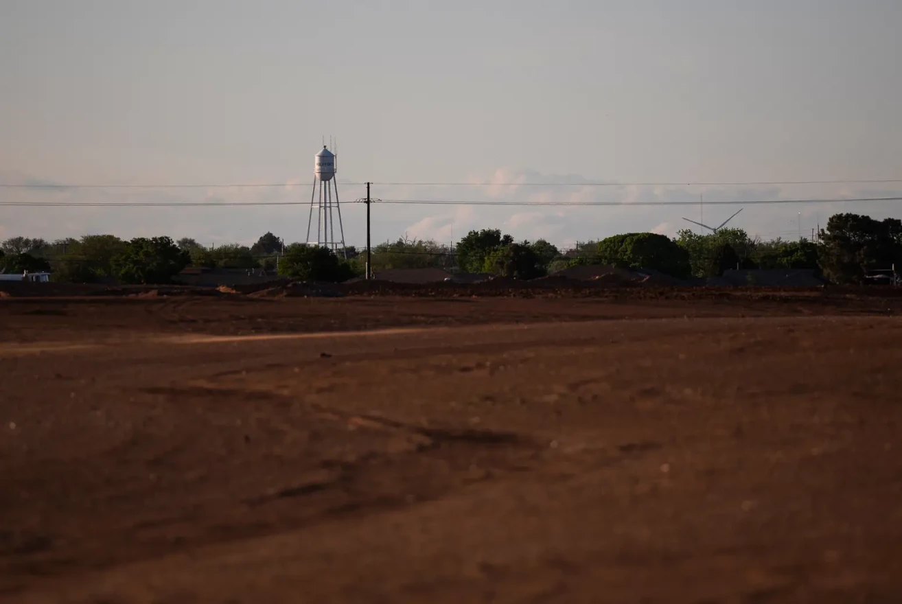 One of the City of Wolfforth’s water towers stands across the city from the construction site of a future neighborhood on April 26, 2023.
